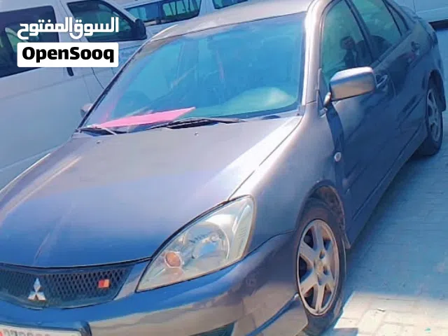 سيارة ميتسوبيشي لانسر سبورت موديل 2006 للبيع. تتميز بنظام فرامل مزدوج، ووسائد هوائية أمامية، وهي نظي