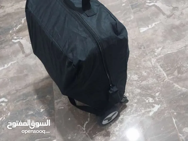 عرباية اطفال معها شنته لضبهاخاصه للسفر