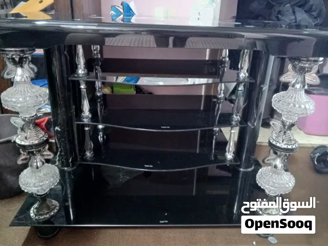 طاولة تلفاز زجاجية لون اسود