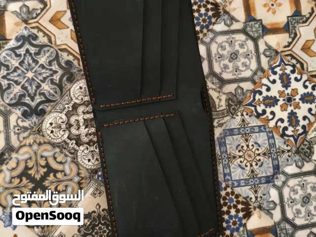 محافظ رجالي جلد طبيعي