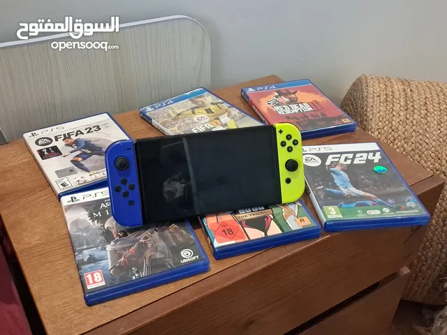 نينتيندو سويتش اوليد مع العاب و العاب بلايستيشن 4 و 5