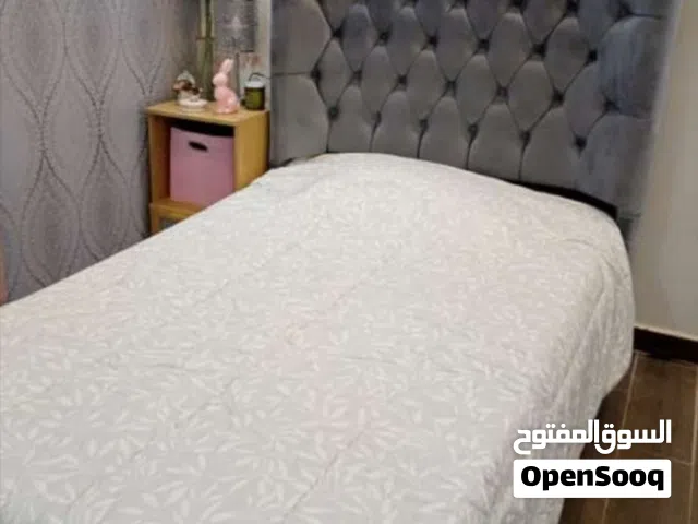 Grey twin bed with mattress included