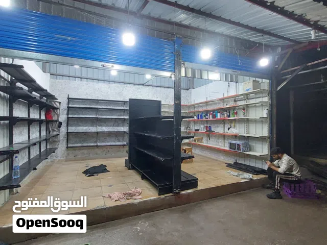 رفوف سوبر ماركت 18متر مع طاوله وسط وستاند حائط