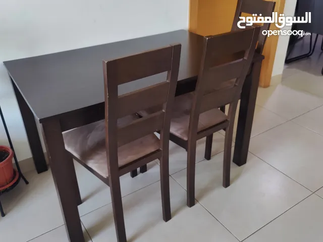 wooden dining table with 4 chairs