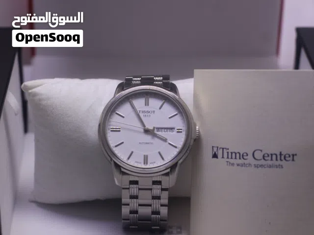 ساعة Tissot Automatics III للرجال مزودة بسوار من الفولاذ المقاوم للصدأ وميناء أبيض. المميزات الرئيسي
