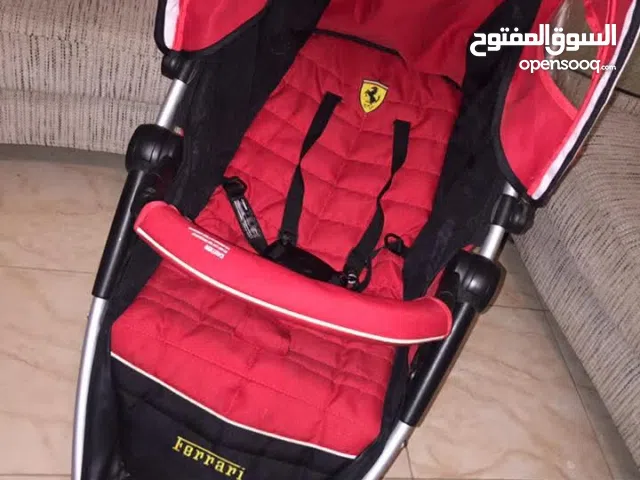 عربة أطفال ماركة فيراري