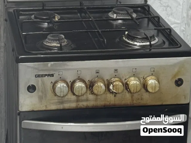 Gas oven with gas cylinder.
