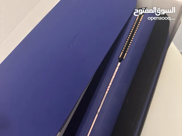 dyson corrale straightener in vinca blue and rose color