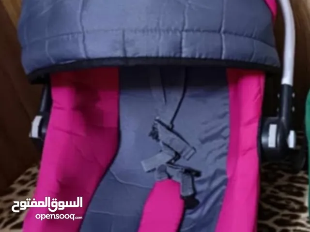 عربانه طفل مستخدم مع كرسي سياره جديد غير مستخدم