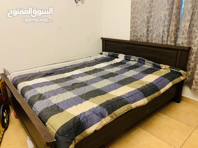 Wooden bed  in good condition with free mattress