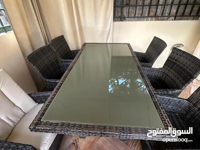 Stylish Outdoor Seating with Modern Glass Table