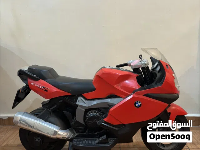 Red and Black BMW kids bike.