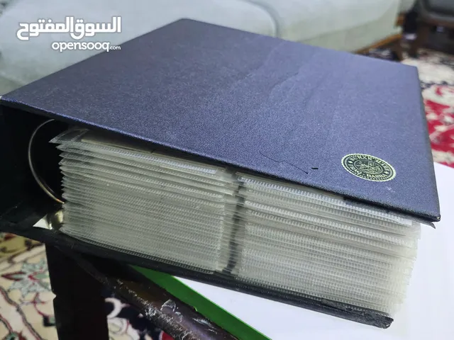 للبيع ألبوم نادر يضم 25 صفحة كاملة من العملات المعدنية المتنوعة، عربية وأجنبية، من عدة دول