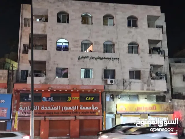 مجمع تجاري و سكني ب دخل سنوي 40-45 الف مؤجر بالكامل