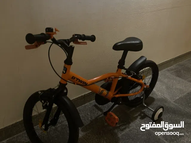 B’Twin Orange Bike – With Training Wheels – Almost New