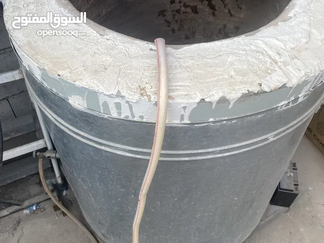 تنور طين ذو قاعدة حديد