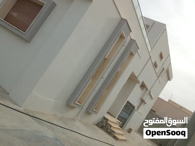 منزل دورين للبيع بضواحي الخمس منطقة الطورة بعد سوق الشعبي عاليسار طريق النهر