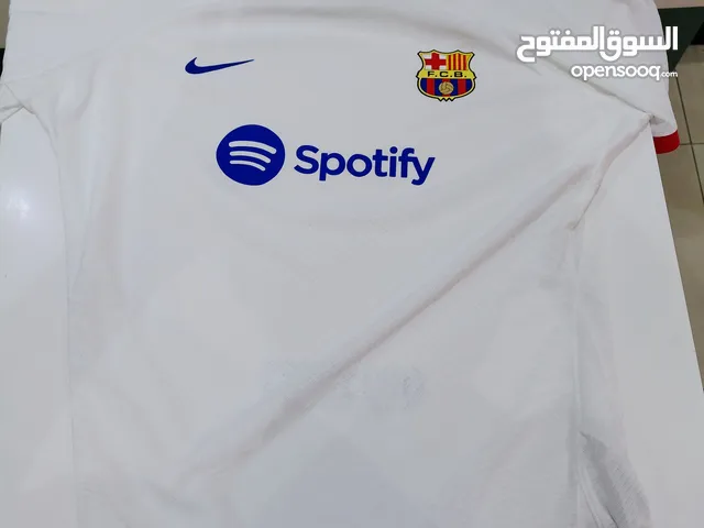 A original Barcelona Fc T-shirt size (XL) And the price 280 AED