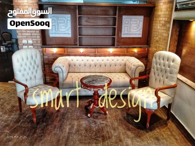 طقم كلاسيك مبطن جلد كابتونيه خشب زان احمر مطعم بالنحاس