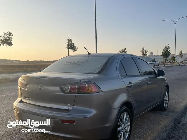 ميتسوبيشي لانسر الفراشة 2015 محرك 16 قوي واقتصادي فل عدا فتحة (جلد تحكم جنط مكيف اوتو )