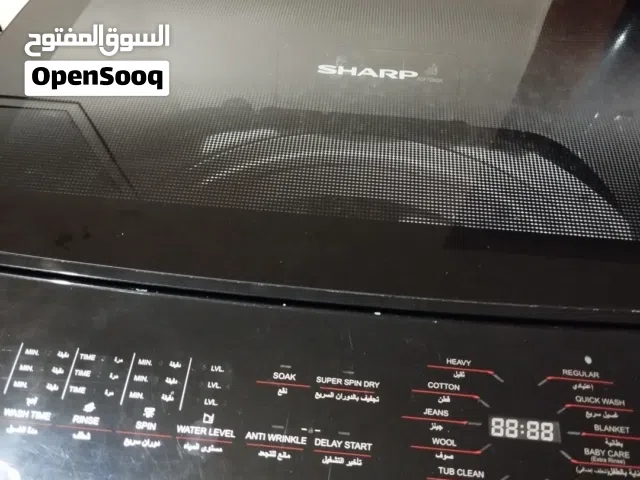 غساله شارب13كيلو شبه جديده في الضمان باقي من الضمان 4سنوات تقريبا الغساله بالتحمع