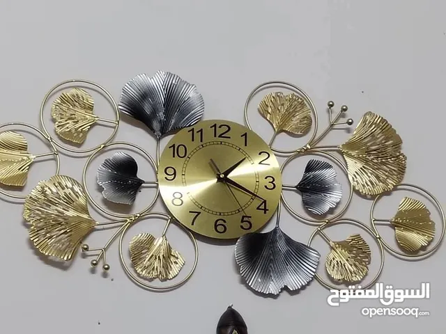 ساعه لوحه معدنيه