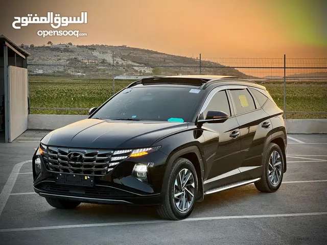 هونداي توسان/2022 فل الفل فتحة سقف بانوراما  2x4 ///240Hp بنزين + كهرباء  ( Haybrid) 1600cc