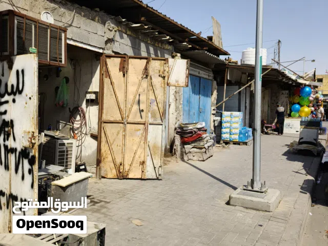 محل تجاوز على الشارع في سوق المسطر مقابل مركز آسيا للهواتف النقالة