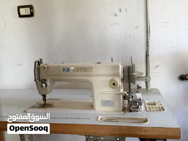 ماكنة خياطة ومنسوجات متوسطة