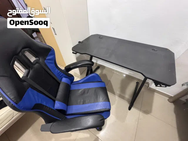 Gaming desk, chair, monitor arm.