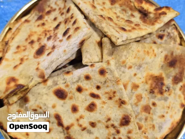 خبز صاج فلزن مهياوة بالزبدة او زيت زيتون او دهن عداني مهياوة اجار ثوم يبل مع طماط او بدون طماط كيلو