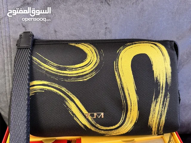 Tumi Clutch “Year of the Snake” and Kinetic Perfume