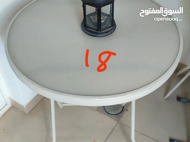 Foldable glass top table