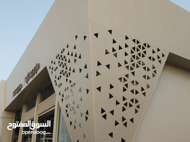 خطاط الكلادينج واللوح الأسمنتي