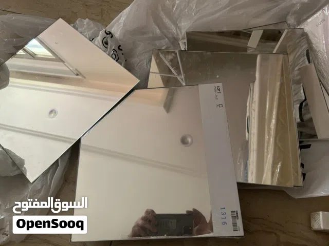 مرايا تلزق على الحائط باأشكال هندسيه