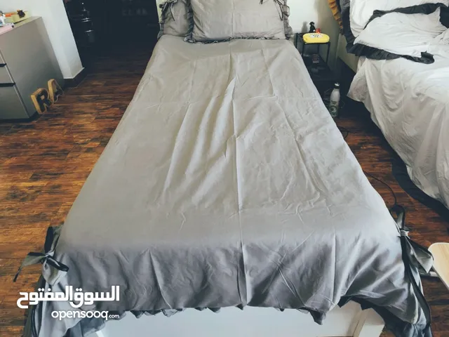 Single bed, bed frame with mattress.