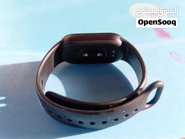 Xiaomi Smart Band, 10, featuring a black strap and advanced health monitoring sensors on the undersi