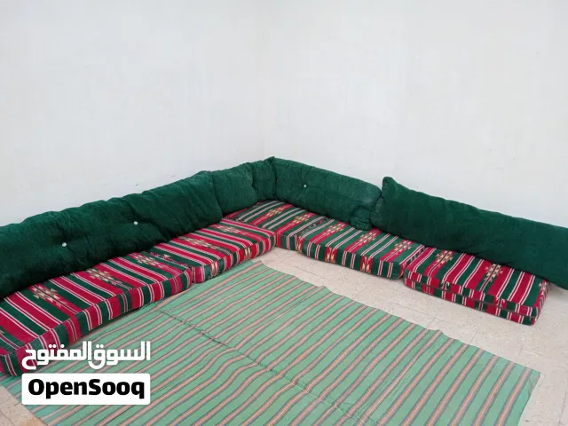 L shaped majlis has 5 big mattress and 3 big green  cushion  it 6 meter long