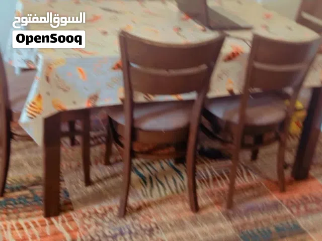 سفره بنية مع 6 كراسي