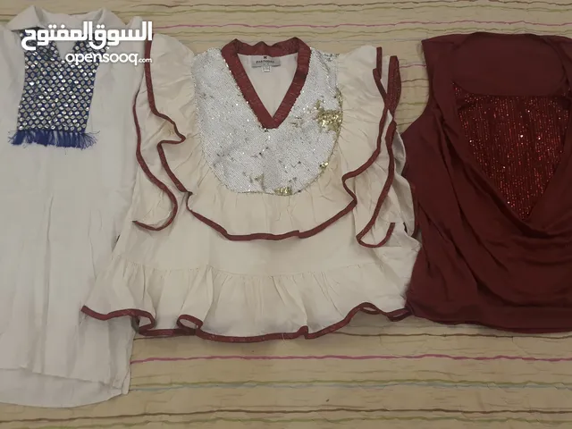 200 قطعة ملابس مستعملة أطفالى ونسائى
