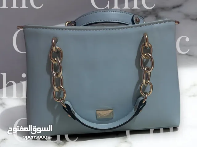 Sac très chic marque sacre vrai cuir couleur bleu claire