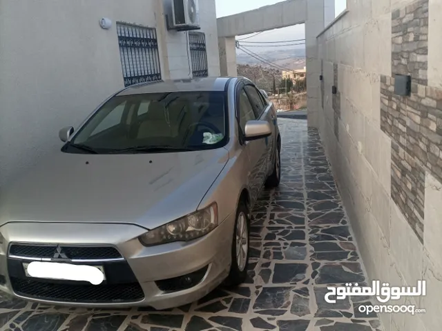 سيارة ميتسوبيشي لانسر 2014/EX للبيع /اعلى صنف(GLS) من المالك مباشرة