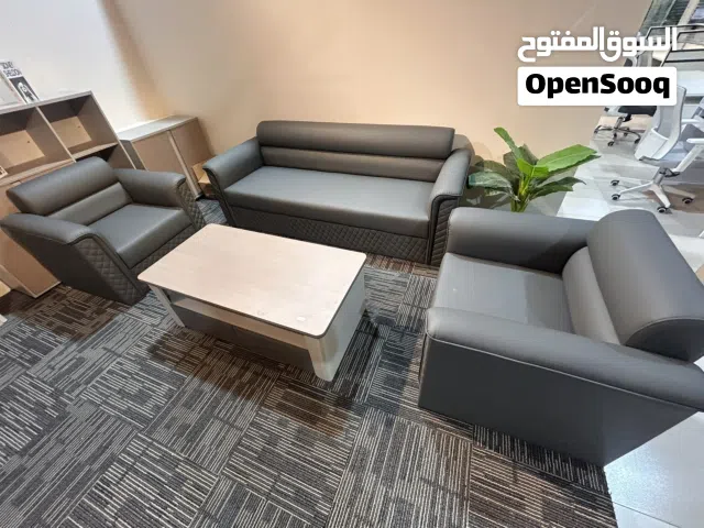 This is a mid-century modern sofa set in grey leather