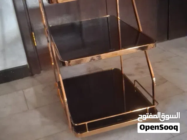 عربة تقديم لون اسود وبرونزي