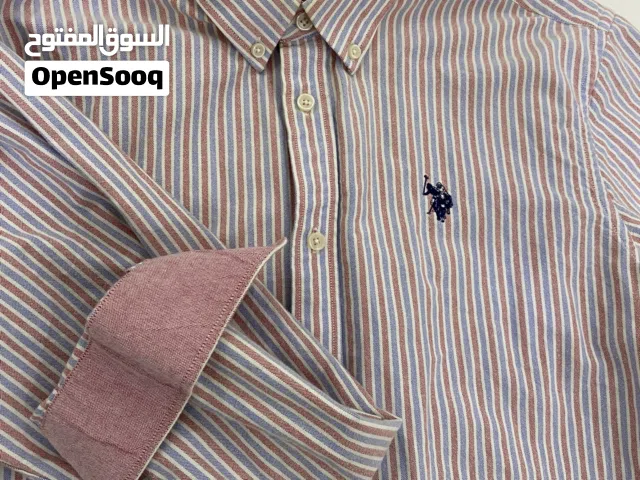 قمصان polo