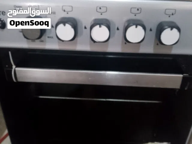 فرن وجرة غاز فوق النص وبربيج وساعة