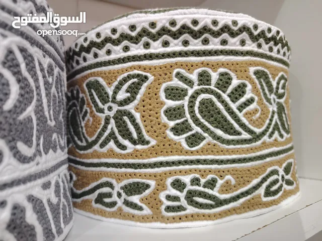 Bangladeshi hand making omani cap