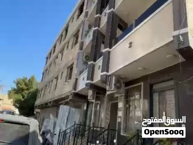 شقة للبيع طابق ارضي بناية جديدة على شارع تجاري