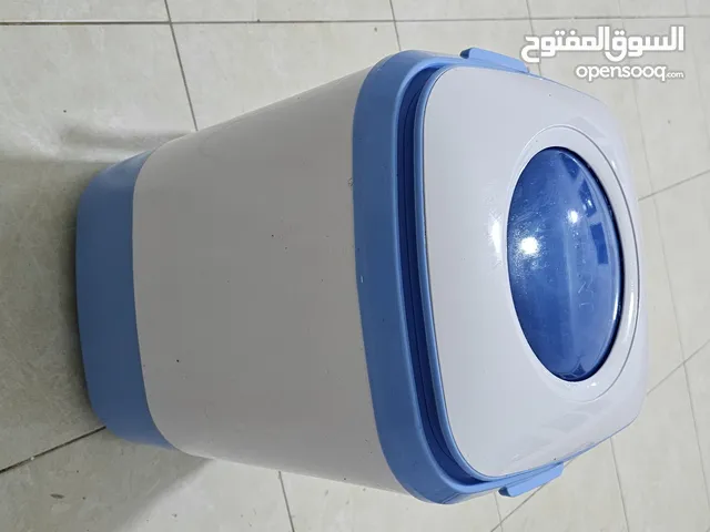 غساله مستعمله مع الغراضها كامله