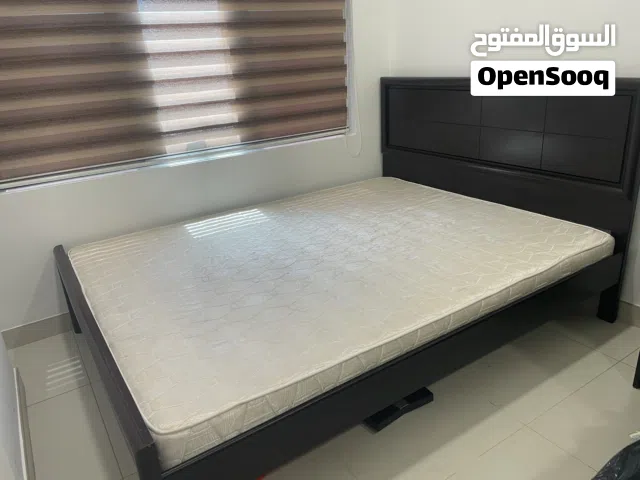 One bed with mattress and one mattress